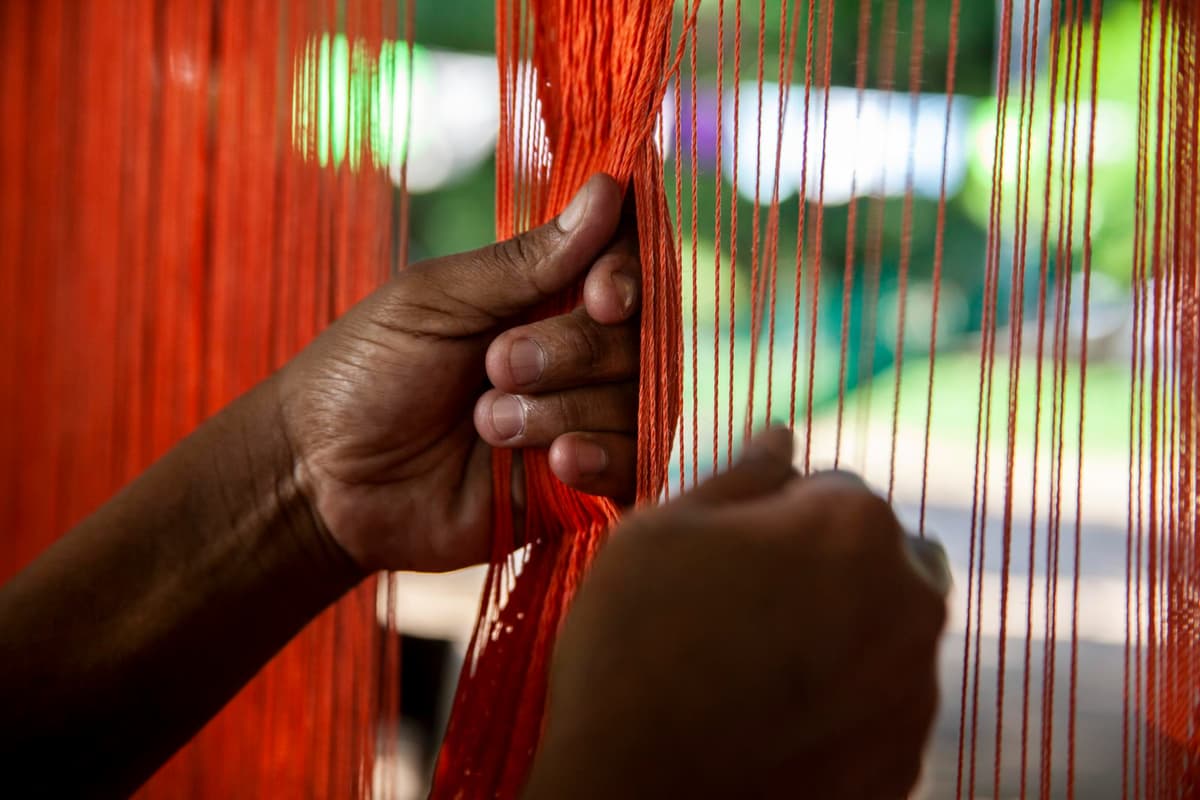 Diverse team of craftsmen and designers working together in modern workshop